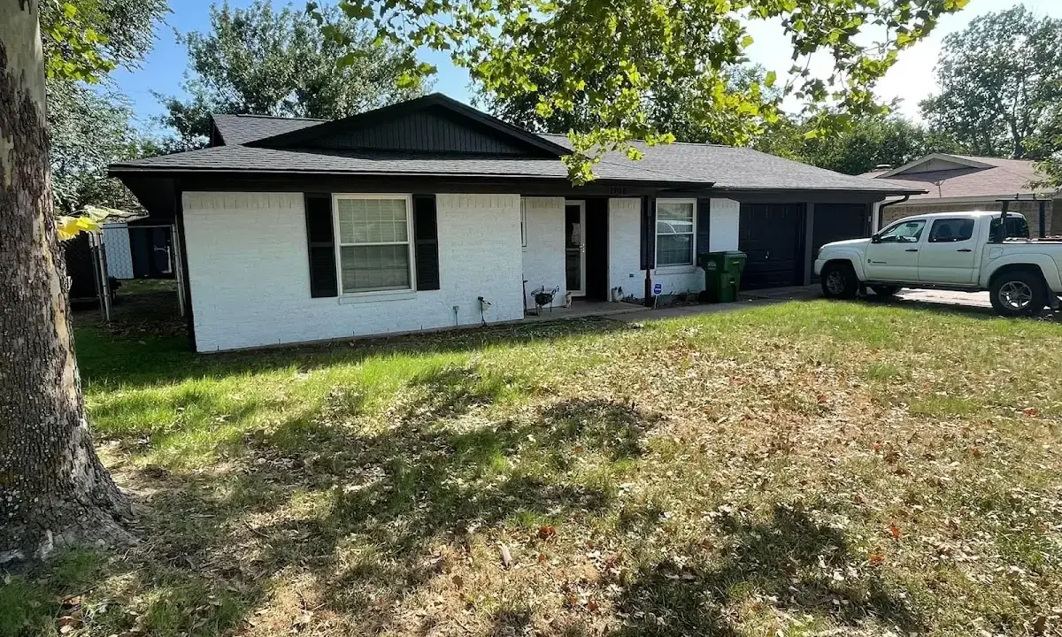 Professional roofing crew working on a residential roof in San Gabriel